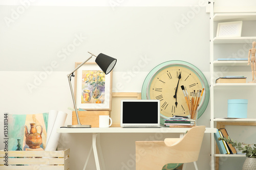Workplace with laptop on ta...