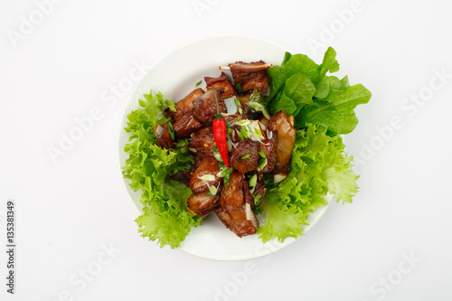 ribs in lettuce on a white background