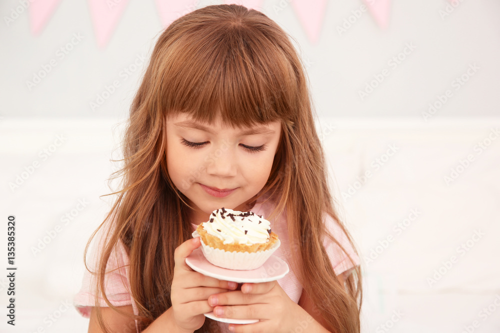 Cute birthday girl eating tasty cake at home Cute birthday girl eating tasty cake at home