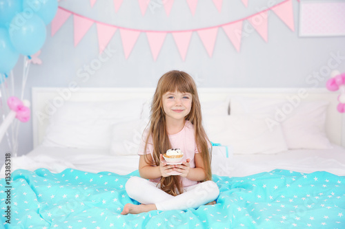 Cute birthday girl sitting ...