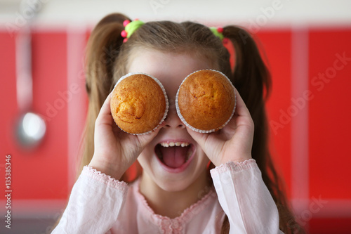 Cute little girl with tasty...