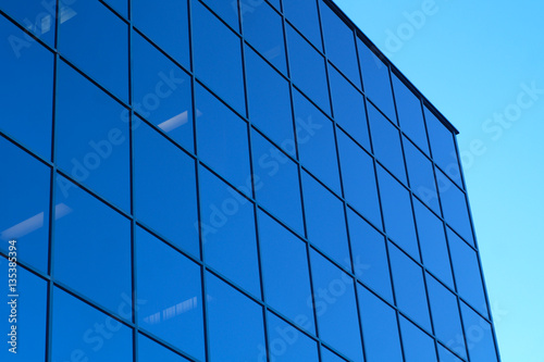 blue skyscraper office tower glass mirror windows and sky