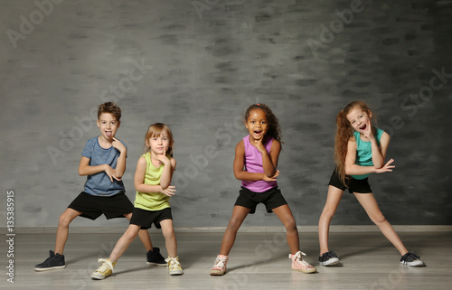 Fototapeta Naklejka Na Ścianę i Meble -  Cute funny children in dance studio
