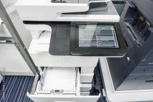 multifunction printer full with paper sheet in tray for printing