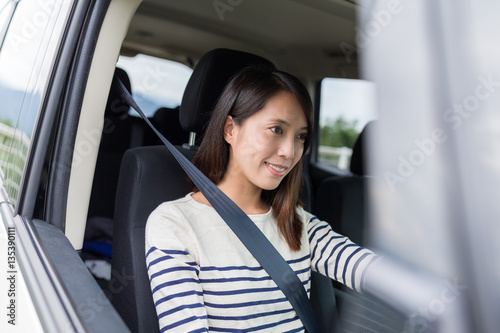 Woman driving a car © leungchopan