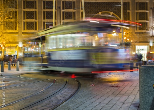 Road with tramway in san francisco at night