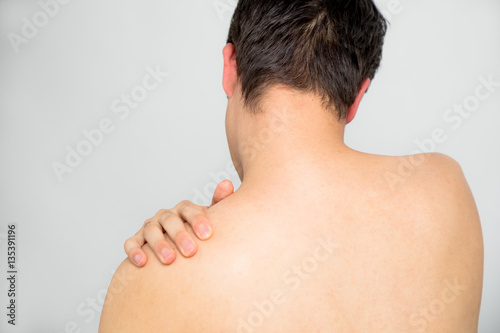 young man's neck and shoulders back view photo