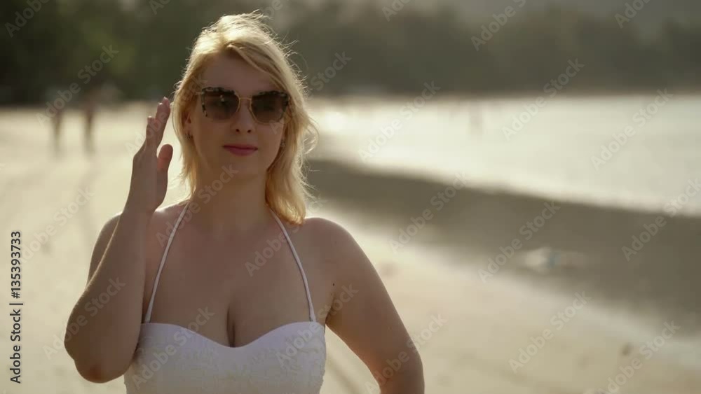 Young sexy blonde woman in bikini on the beach Young sexy blonde woman in bikini on the beach