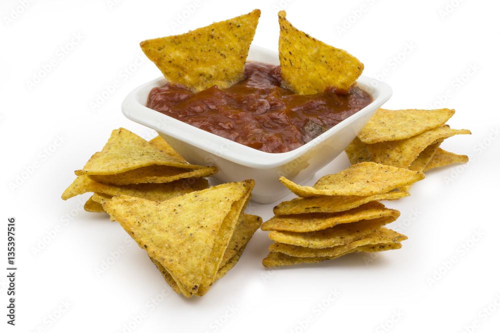 Tortilla chips with hot dip isolated on white background. Clipping path included in JPEG. Tortilla chips with hot dip isolated on white background. Clipping path included in JPEG.