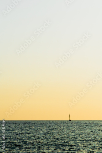 alone sailboat in the sea on sunset © extracoin