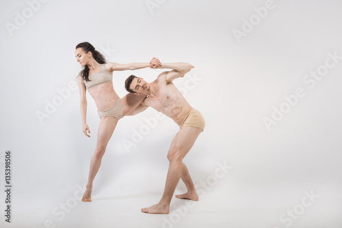 Wallpaper Mural Young dancers performing in close interaction with each other Torontodigital.ca