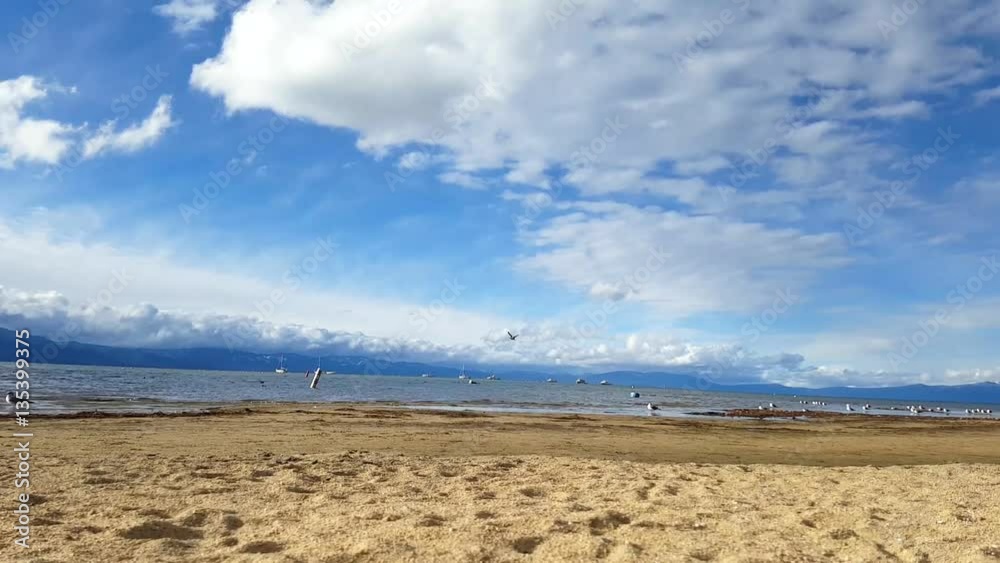 Timelapse of the beach at south lake Tahoe in front of snowy mountains, in earley november, in Lake Tahoe, in California, United states of America Timelapse of the beach at south lake Tahoe in front of snowy mountains, in earley november, in Lake Tahoe, in California, United states of America