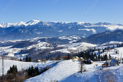 winter landscape with a mountain village in Romania