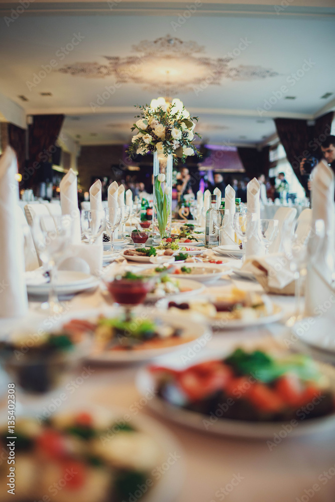 variety of delicious snacks stand on the wedding table