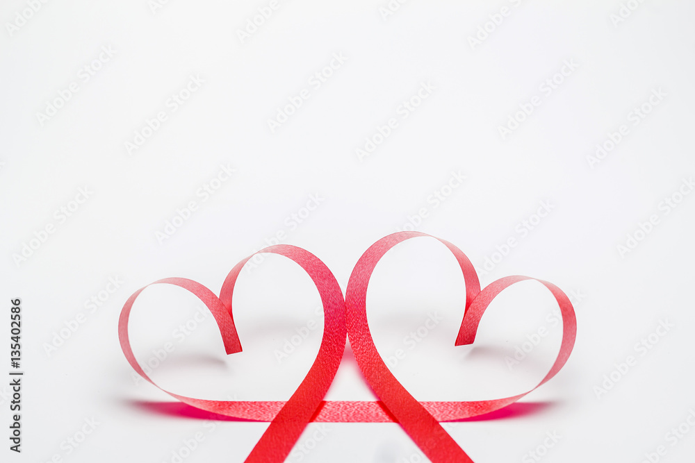 Ribbons shaped as hearts on white background, valentine's day.