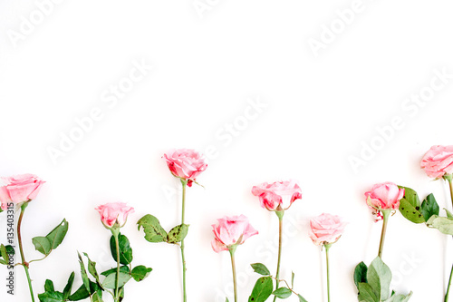 Pink roses on white background. Flat lay  top view. Valentine s background