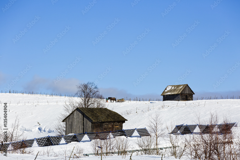 Old wooden house in winter landscape, Romania Old wooden house in winter landscape, Romania