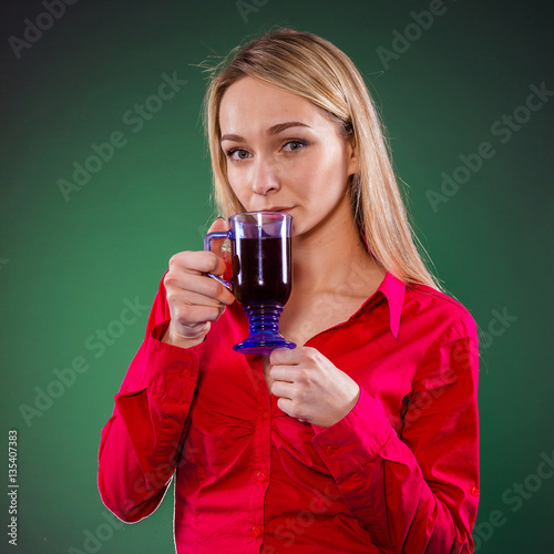 Sick woman drinking tea from illness