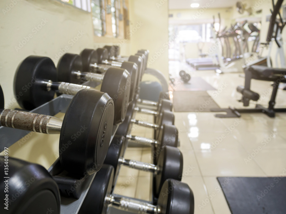 Fototapeta premium Sports dumbbells in modern sports club. Weight Training Equipment