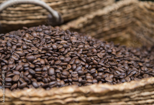roasred coffee beans in wicker basket