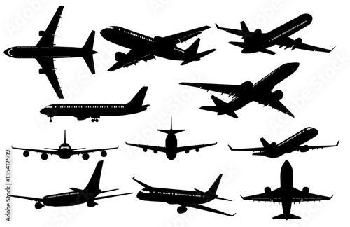 Vászonkép Silhouettes of Airplanes