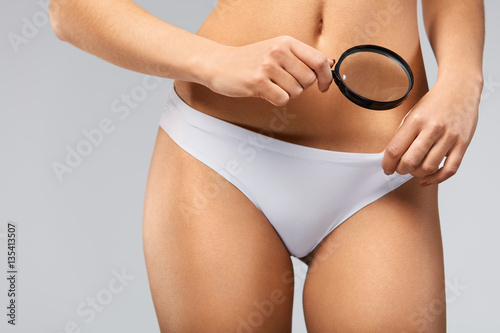 Female Health. Сloseup Of Woman In Bikini Exploring Her Body