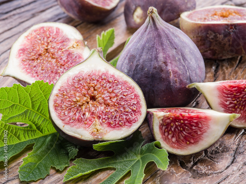 Ripe fig fruits on the wooden table.