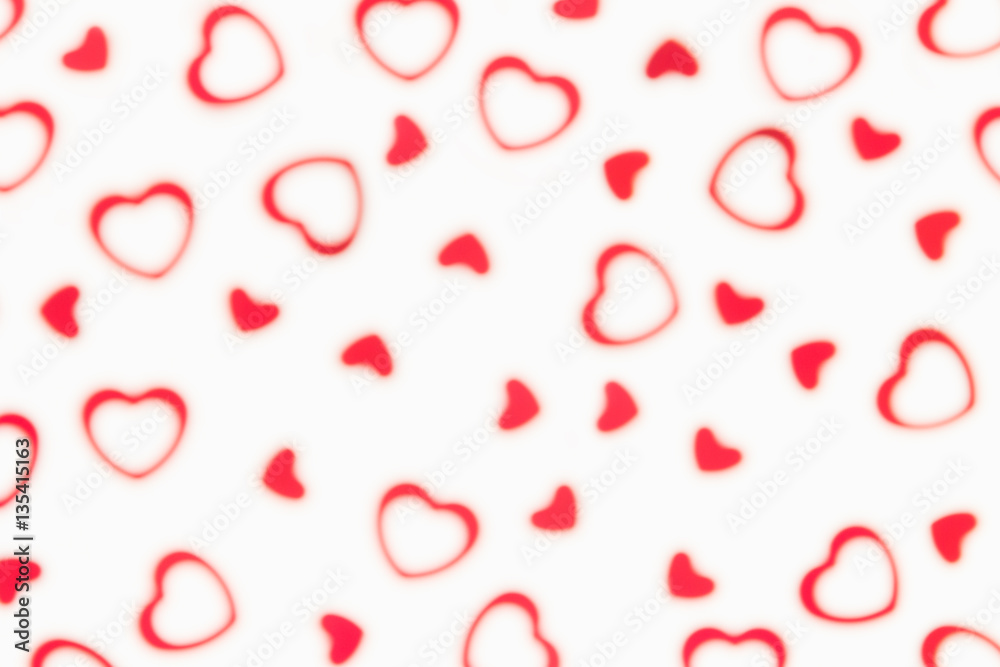 Valentine's day decorative soft blur abstract pattern of red hearts confetti on white background. Festive valentine backdrop. Valentine's day decorative soft blur abstract pattern of red hearts confetti on white background. Festive valentine backdrop.