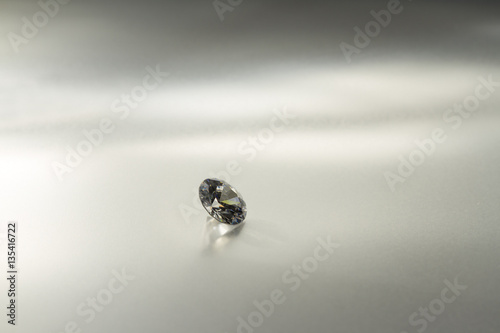 Beautiful big diamond jewelry on gray background. Fine natural precious stone.Brillant shine. © macrowildlife
