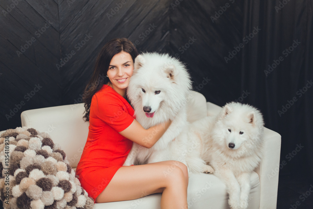 Cute, attractive girl with fluffy dog