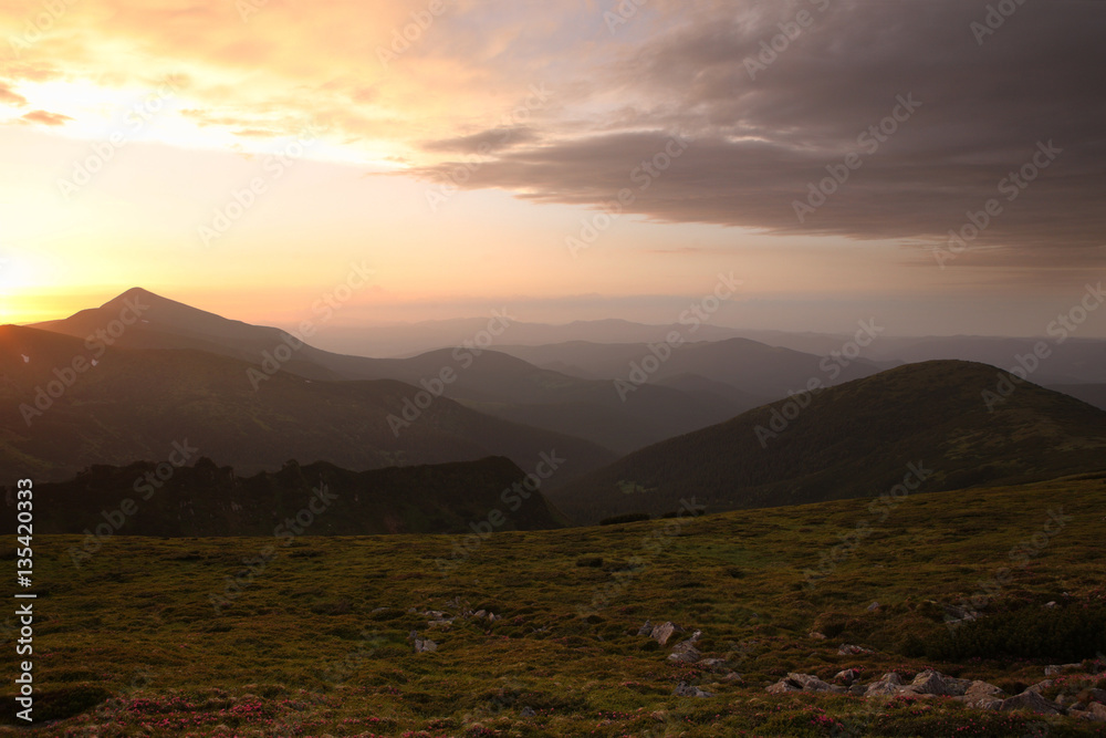 Beautiful view of the sky at sunset in Carpathians in the summer Beautiful view of the sky at sunset in Carpathians in the summer