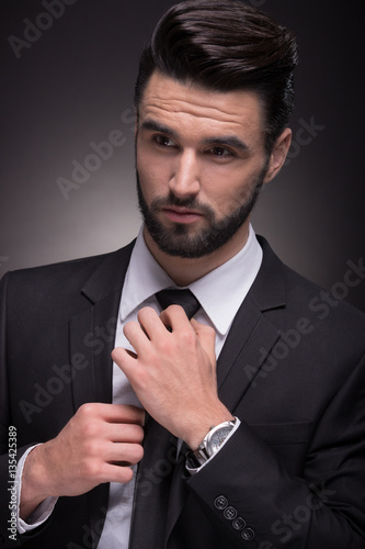 young man elegant suit necktie knot