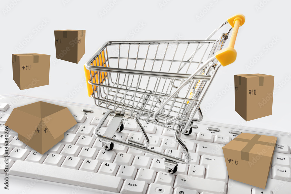 Einkaufswagen, Tastatur und Pakete - Onlinehandel