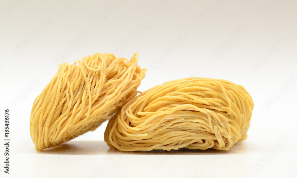 Balls of uncooked noodle tightly bunched Balls of uncooked noodle tightly bunched
