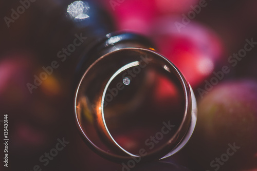 Wedding rings.  symbols, attributes. Holiday, celebration. with blur couple heart and flowers © Denis Ovcharenko