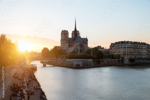 Cathedral of Notre Dame de Paris with Seine river at sunset. Par