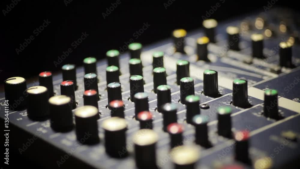 Close up video of a mixer desk with many buttons and shifting focus. Close up video of a mixer desk with many buttons and shifting focus.