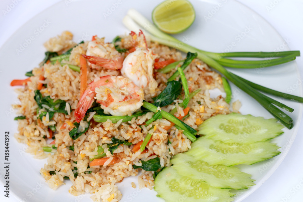 Delicious Shrimp fried rice. Unique style in the white dish on white background, Thai food. Delicious Shrimp fried rice. Unique style in the white dish on white background, Thai food.