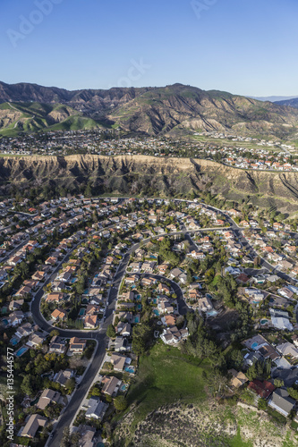 Aerial view of streets and homes in the suburban Porter Ranch neighborhood of Los Angeles California. 