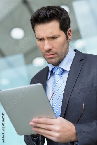 Businessman using a Tablet pc in financial district