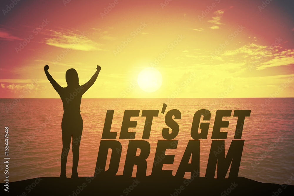 Silhouette woman standing and raising up her finger about winner concept on let get LET GET A DREAM text over a beautiful sunset , sunrise at the sea. background for success.hope to business success Silhouette woman standing and raising up her finger about winner concept on let get LET GET A DREAM text over a beautiful sunset , sunrise at the sea. background for success.hope to business success