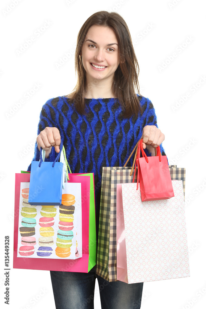Happy girl holding shopping bags. The concept of selling, buying, fashion. Happy girl holding shopping bags. The concept of selling, buying, fashion.