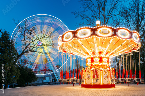 Illuminated Attraction Ferris Wheel And Carousel Merry-go-round  photo