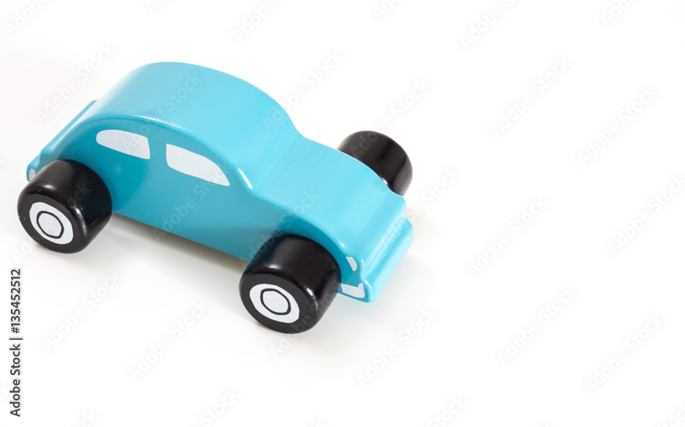 A blue toy car, on white background with copy-space. A blue toy car, on white background with copy-space.