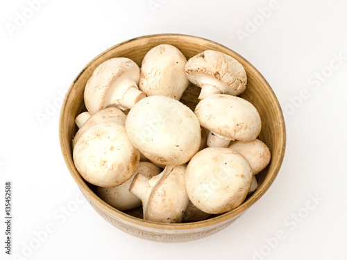 mushrooms in a bowl on a white background