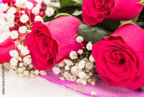 Closeup of red roses bouquet with white flowers