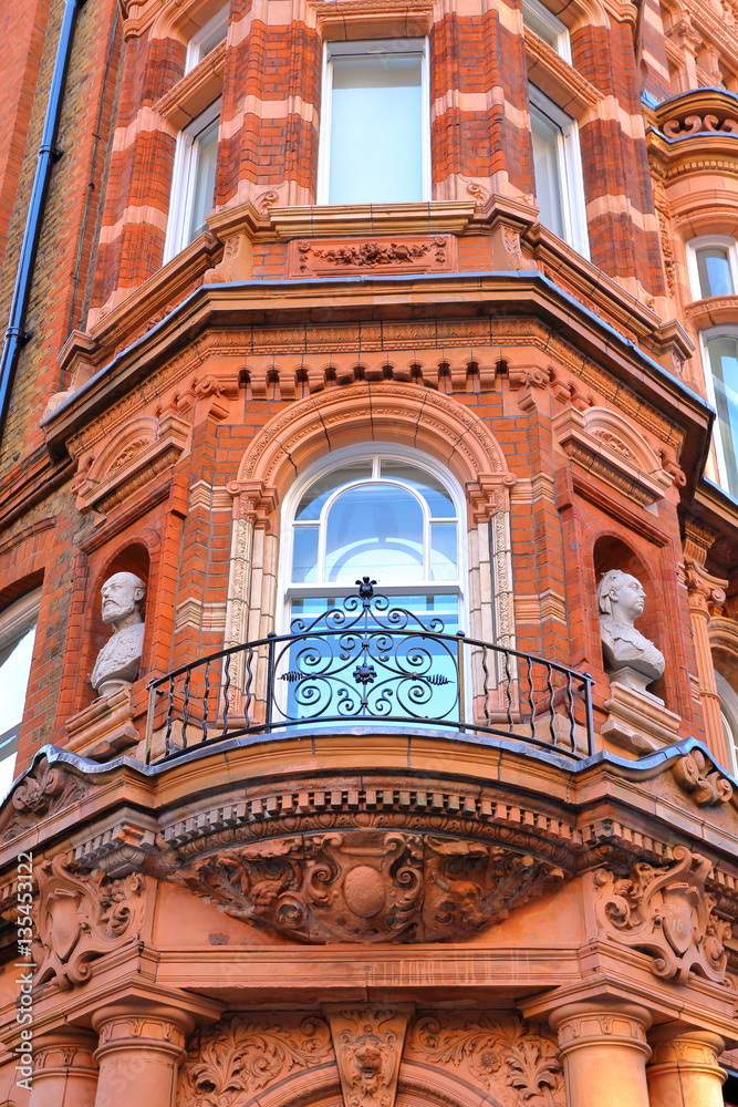 LONDON, UK: Details of red brick Victorian houses facades in the borough of Westminster
