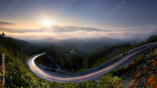 The Long road in to nature , morning mist sunrise at Doi Inthanon, Chiang Mai, Thailand .