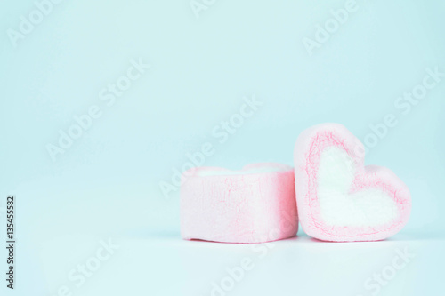 Candy hearts on a blue background / heart represents love in Valentine's Day / wedding day.