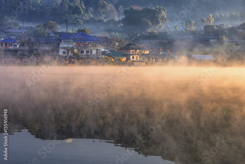 Morning mist at Ban Rak Thai , a popular tourist attraction . Mae Hong Son province, North of Thailand .